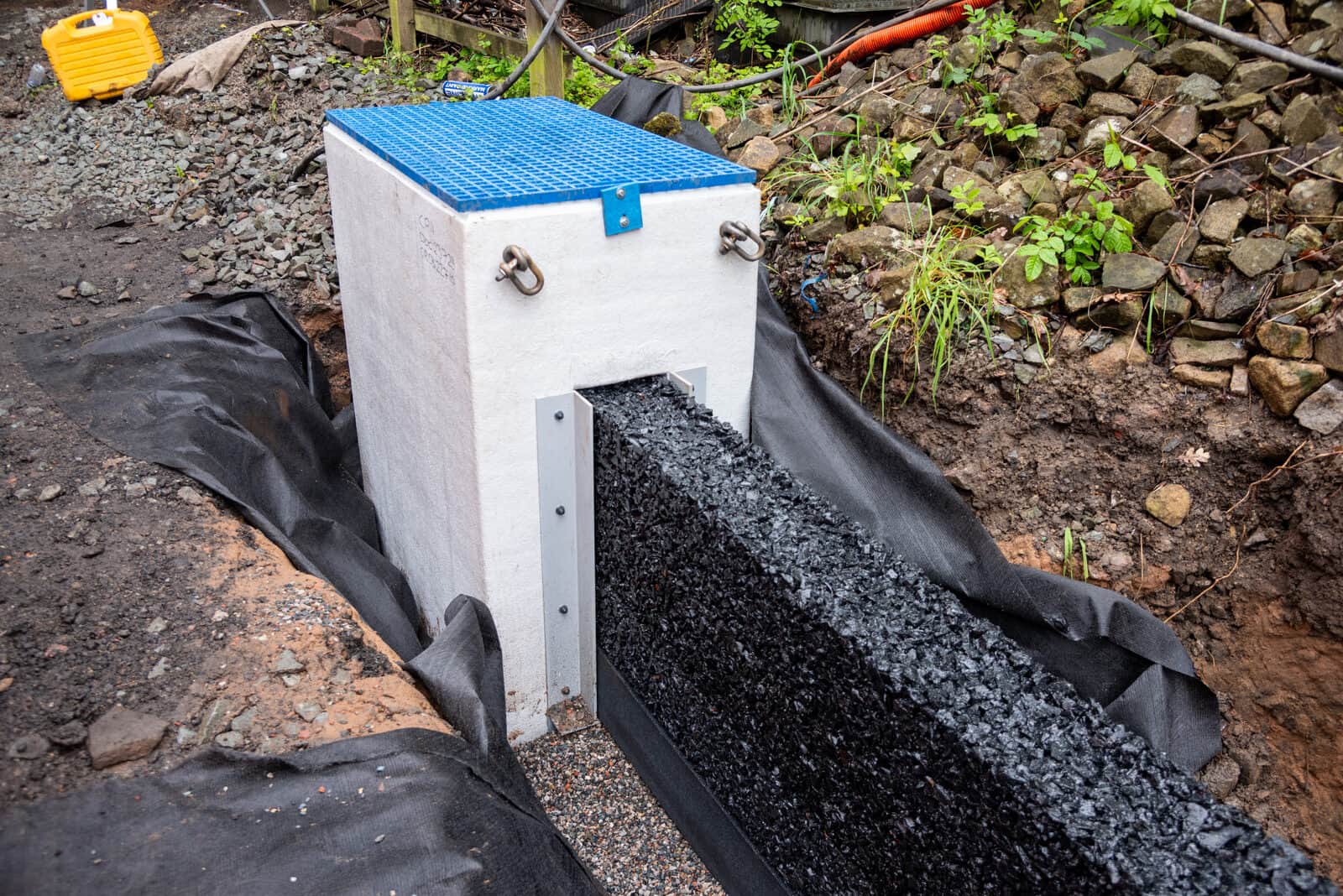 Rosehill Drainage System catchpit and stone-filled trough at Newton Heath Metrolink depot
